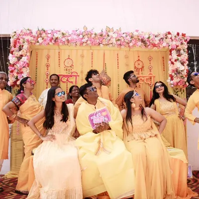 A fun-filled family portrait from a Haldi ceremony. I love capturing these moments of collective joy and playful celebration that you'll cherish forever.