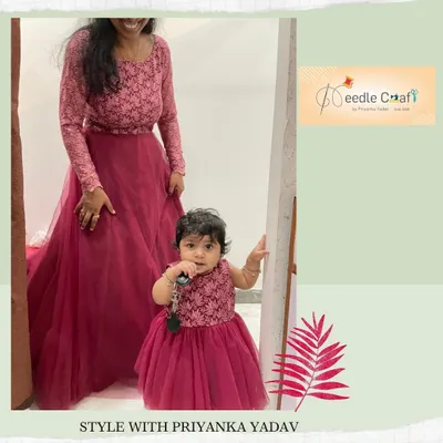 This matching mother-daughter gown set in a deep magenta was a joy to create. I used a delicate lace fabric for the bodice on both gowns and a flowing tulle for the skirt, ensuring a comfortable fit for both mom and baby.