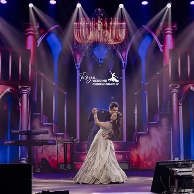 A classic ballroom moment against a grand, palatial backdrop. This choreography focused on elegance and romance, making the couple look and feel like royalty on their special night.