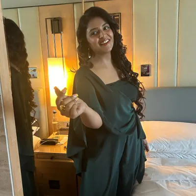 A candid moment with my client, looking radiant in the dark green jumpsuit I styled for her. This look was perfect for the Mustela India event, projecting both warmth and professionalism.