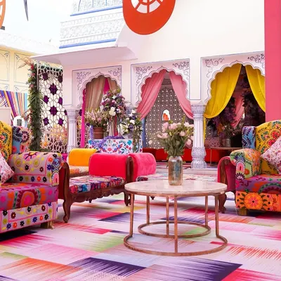 We transformed the courtyard at The Leela Jaipur into a kaleidoscope of color for a vibrant Haldi. The space features eclectic, brightly upholstered furniture and a multi-hued floor, creating a festive and energetic atmosphere for the celebration.