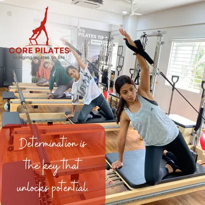In our small group classes, everyone gets the attention they need. Here, clients are performing a synchronized mermaid stretch, focusing on oblique strength and spinal mobility.