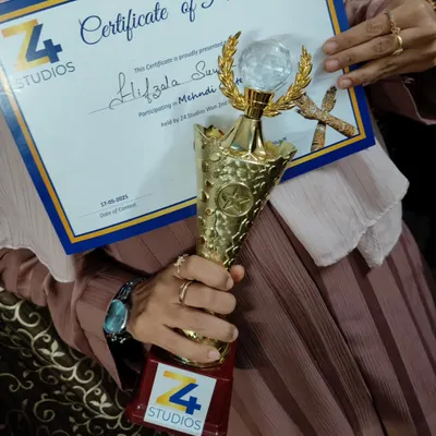 So proud to have received this trophy and certificate. It's an honor to be recognized for my passion and hard work in the art of mehendi.