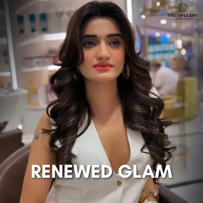 This is the ultimate party-ready look. We created soft, voluminous waves and paired them with a dewy makeup base, defined brows, and a vibrant coral-pink lip to create a fresh and glamorous vibe.