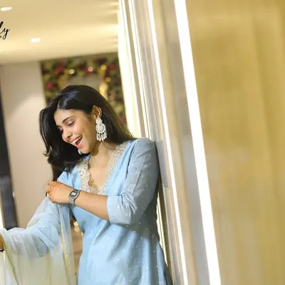 A candid shot of a guest laughing during a party. I use the architectural elements and lighting of the venue to frame my subjects and create natural, interesting portraits.