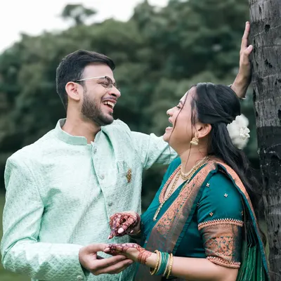 This is the essence of our photography. A moment of pure, uninhibited laughter between a couple, captured naturally during their outdoor pre-wedding shoot.