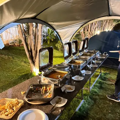 My dinner is served buffet-style right in the heart of the campsite. You can enjoy a delicious spread of dishes under the open sky.