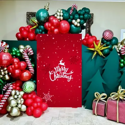 Photo booths are a must have for any celebration. I designed this whimsical Christmas photo corner using a combination of balloon art to create candy canes and ornaments, custom-cut trees, and a bold red backdrop. It’s a fun, festive, and perfectly Instagrammable addition to any corporate holiday party.