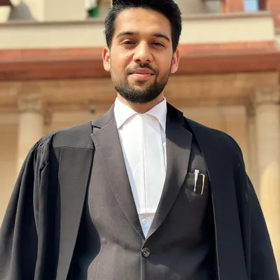 Dressed in my advocate's robes outside the Supreme Court of India. My practice is rooted in years of navigating the highest levels of the Indian judicial system.