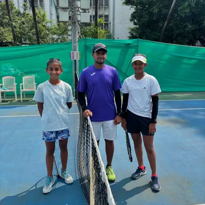 A coach with two junior players at the Inter School Tennis Tournament 2024 at Bombay Gymkhana, an event with over 530 entries that we helped organize.