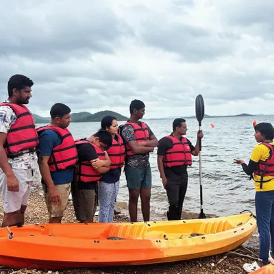 Safety and proper technique are our first priorities. Here, an instructor gives a shore-side briefing to a group of participants before they head out for a kayaking session at Vani Vilas Sagar.