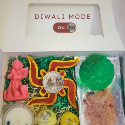 This Diwali, gift more than just light. Our festive hampers are filled with handmade candles, soothing soaps, and relaxing bath salts to make the season special. This one includes an angel candle, a swastika, and other festive treats.