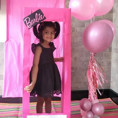 Here's another little one enjoying our Barbie-themed party setup. The life-sized doll box is always a huge hit and makes for the cutest pictures of the birthday star and their friends.