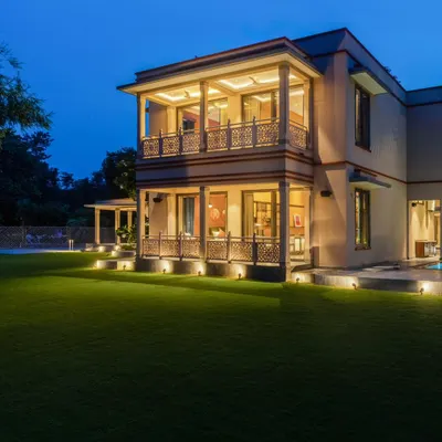 An evening view of a beautiful farmhouse project. I installed discreet, landscape-integrated speakers and subtle uplighting to create a perfect ambiance for outdoor gatherings. The system is designed to withstand the elements while delivering rich sound.