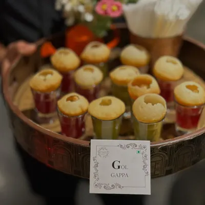 A party isn't complete without Gol Gappe. We serve them in a unique and hygienic way, with individual shot glasses of sweet and spicy water, making it a fun and mess-free experience for your guests.