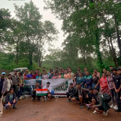 Our trekking family posing for a group photo with the Indian flag. These trips bring together people from all walks of life, united by a love for adventure.