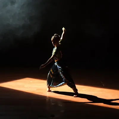 A dramatic moment from my solo production 'Ananta'. The play of light and shadow is a powerful tool in dance, helping to sculpt the space and guide the audience's focus.