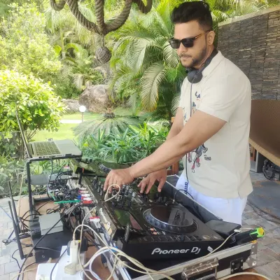 Mixing a relaxed set at a beautiful outdoor venue near Pawna Lake. I specialize in creating the perfect vibe for sundowners and daytime events.