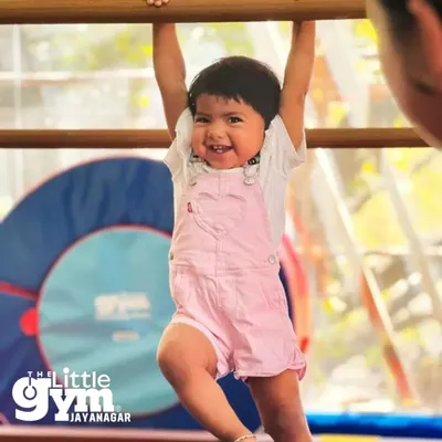 Look at that happy face! Our Parent-Child classes are all about smiles and building strength, one happy hang at a time.