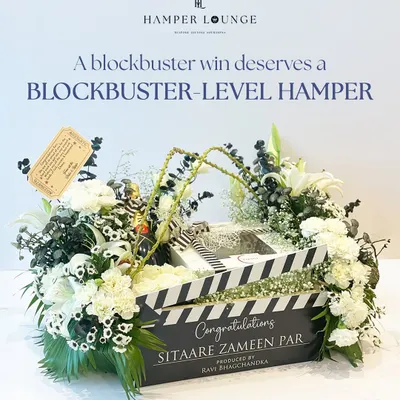 This is the hero shot of the 'Sitaare Zameen Par' hamper I created for the film's cast and crew. The custom clapperboard box, filled with champagne and flowers, is a prime example of how I tailor gifts to a specific event, making the celebration even more memorable.