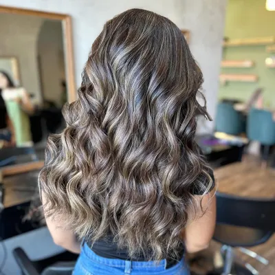 This frosty, multi-tonal look was the result of an eight-hour color correction session. It showcases the advanced skills and patience required to tackle complex hair challenges.
