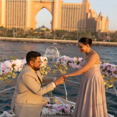 The perfect proposal moment captured on a yacht in Dubai, with the iconic Atlantis hotel in the background. A truly unforgettable memory from a luxury pre-wedding shoot.