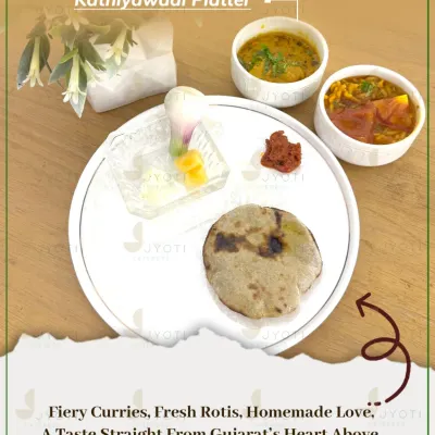 A taste of home with this traditional Kathiyawadi Platter. It features authentic Gujarati dishes like fiery curries, fresh rotis, and homemade pickles, served with love.