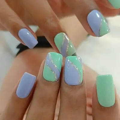 A lovely pastel combination of mint green and lavender, accented with a wavy silver glitter line for a soft and pretty look.