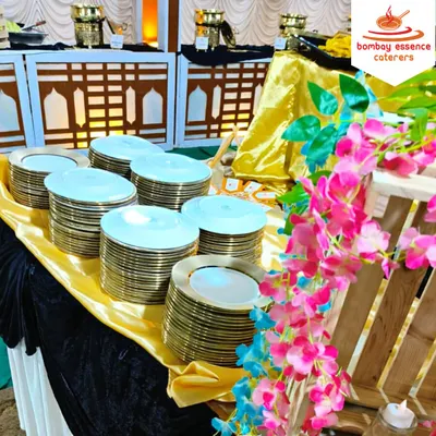 For a beautiful wedding at Narayan Gardens, we set up this stunning buffet. The decor featured gold and black linens with floral accents, complemented by our premium gold-rimmed plates, creating a luxurious dining atmosphere.
