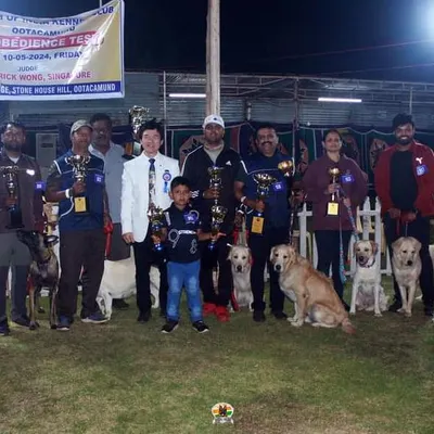 A proud moment for the K9 Gurukul family at the 102nd Obedience Dog Show in Ooty. Our team and their dogs are pictured here with the judges and the trophies we won.