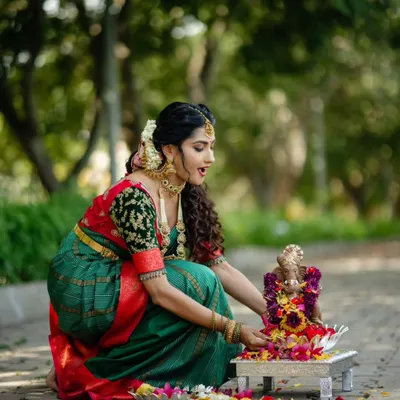 Celebrating Gowri Ganesha Habba in style. This traditional green and red silk saree is perfect for festive occasions.