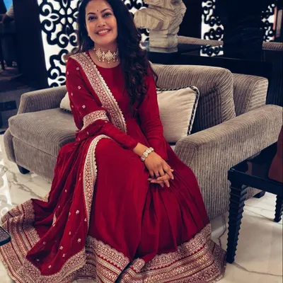 Styling the talented singer Priyanka Barve for a Diwali event. She looks absolutely radiant in a deep red Anarkali with intricate gold embroidery, a perfect choice for a festive performance.