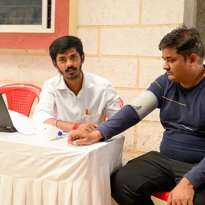 A glimpse from our free Bone Mineral Density camp, where I am conducting a health check-up. Community outreach is an important part of my mission to make Ayurvedic care accessible.