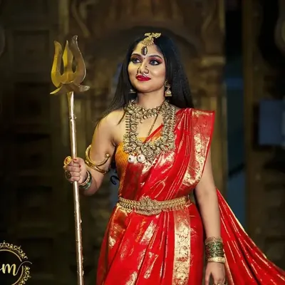 A powerful depiction of Goddess Durga, adorned in our heavy temple jewellery. This look features a layered haram, choker, and traditional armlets, perfect for Navaratri.