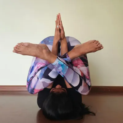 This is a challenging variation of Halasana (plow pose) that provides a deep stretch for the entire spine and shoulders. Remember, consistency and discipline are what lead to progress in your flexibility journey, not just motivation.