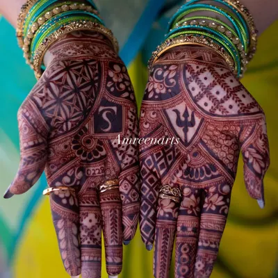 This is the result of my natural henna paste. A deep, rich maroon stain that looks stunning against the bride's colorful bangles.