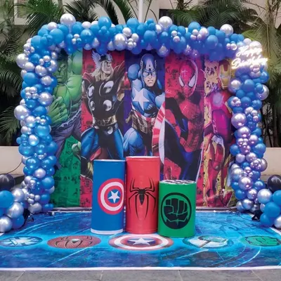 An epic superhero theme party featuring a full backdrop of Marvel's mightiest heroes. We completed the look with a blue and silver balloon arch and themed pedestals for Captain America, Spider-Man, and the Hulk.