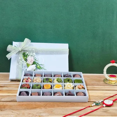 Gift your sibling the purest form of love with our 'Rakhi ki Mitaas'. This 24-piece box of exotic dry fruit mithai is crafted without ghee or artificial flavours, making it a healthy and luxurious Rakhi gift.