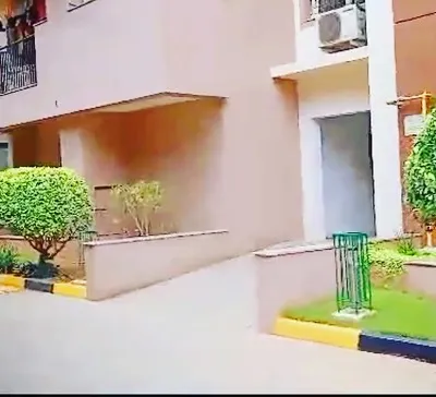 This is an example of our maintenance work for an apartment building. We keep the shrubs neatly trimmed and the lawn healthy, enhancing the building's curb appeal for all residents.