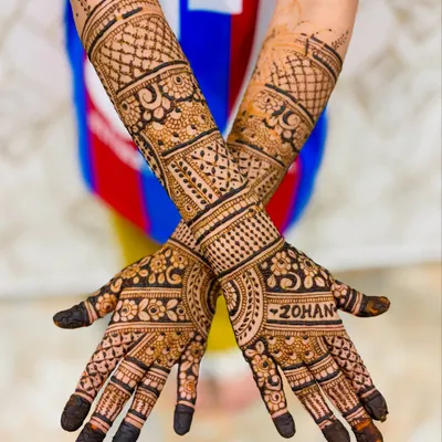 Even our youngest clients can get elaborate designs. This 6-year-old chose a full-arm mehendi, and we were happy to oblige with our skin-safe organic paste.