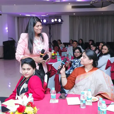 Moving through the audience at the AccelHERate conference. I make it a point to interact directly with attendees, ensuring their questions are heard and making the session more dynamic.