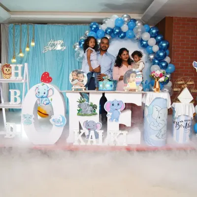 A complete elephant-themed birthday setup with the family, showcasing the full scale of the decor. We added a dry ice effect for a touch of magic during the cake-cutting ceremony.