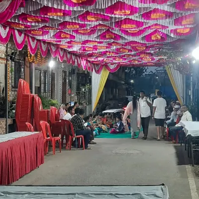 A wide view of a street event we organized at night. You can see the extensive ceiling decoration, lighting, and seating arrangements we put in place to create a festive atmosphere for the guests.