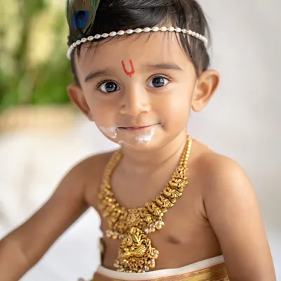 My little Krishna, with a little bit of butter on his face. These themed sessions are so much fun and create such memorable portraits.