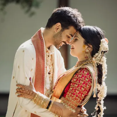 An intimate close-up of a couple, their foreheads touching, capturing a moment of pure love and connection.