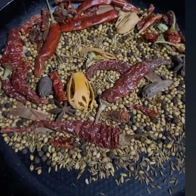 The foundation of my aromatic biryani masala. I toast a variety of whole spices like coriander seeds, cumin, peppercorns, and dried red chillies before grinding them to create a fresh, potent blend.