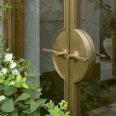 This bespoke brass door handle was designed for the DUA Villa. Its circular form echoes the arched openings throughout the home, creating a cohesive design language that is carried down to the smallest tactile element.