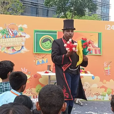 Performing at the 24/7.ai Summer Carnival. My flower magic is always a colorful and visual highlight, perfect for entertaining families and kids at outdoor corporate events.