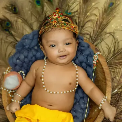 Our little Bal Gopal with the sweetest smile. This Janmashtami-themed shoot captures the playful and divine spirit of Krishna.