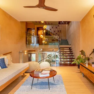 The informal living area in the Terravana Villa is a curated space that blends artisan furniture with traditional materials. I used lime plaster on the walls and Kota stone for the flooring to create an earthy, tactile environment that promotes a sense of well-being and connection to nature.